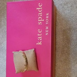 kate spade "Cheers" goldtone bangle bracelet